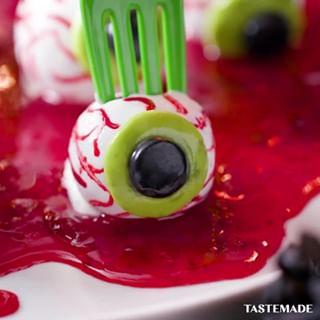 These eyeball cake pops come with a spooky surprise inside. ⁠
⁠
Monster Eyeballs⁠
Ingredients:⁠
1 pre-made red velvet cake⁠
1/4 cup frosting ⁠
1 cup melted white chocolate ⁠
Strawberry jam ⁠
Green and black fondant ⁠
Red food coloring ⁠
⁠
Steps:⁠
1. Add cake and frosting to a food processor and pulse until combined. Roll cake into golf ball-size balls. Pipe strawberry jam into the center of the cake balls. Dip into melted chocolate and chill for 10 minutes. ⁠
2. Roll out fondant and use a round piping tip to cut out the green and black eyeball. Using a small paintbrush, brush on red food coloring to make the veins. ⁠