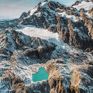 I have lived in Washington state for 8 years and have never seen the tops of the Olympic mountains. They are covered in alpine lakes, glaciers, hidden caves and filled with wildlife. This state continues to amaze me the more I see of it . This is from my flight with @atomic_helicopters by the top of Mt. Olympus. Bright blue untouched alpine lakes are some of my favorite things to be found in nature 