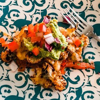 Trev made cauliflower nachos from our meal plan and they were damn good. 🥑 